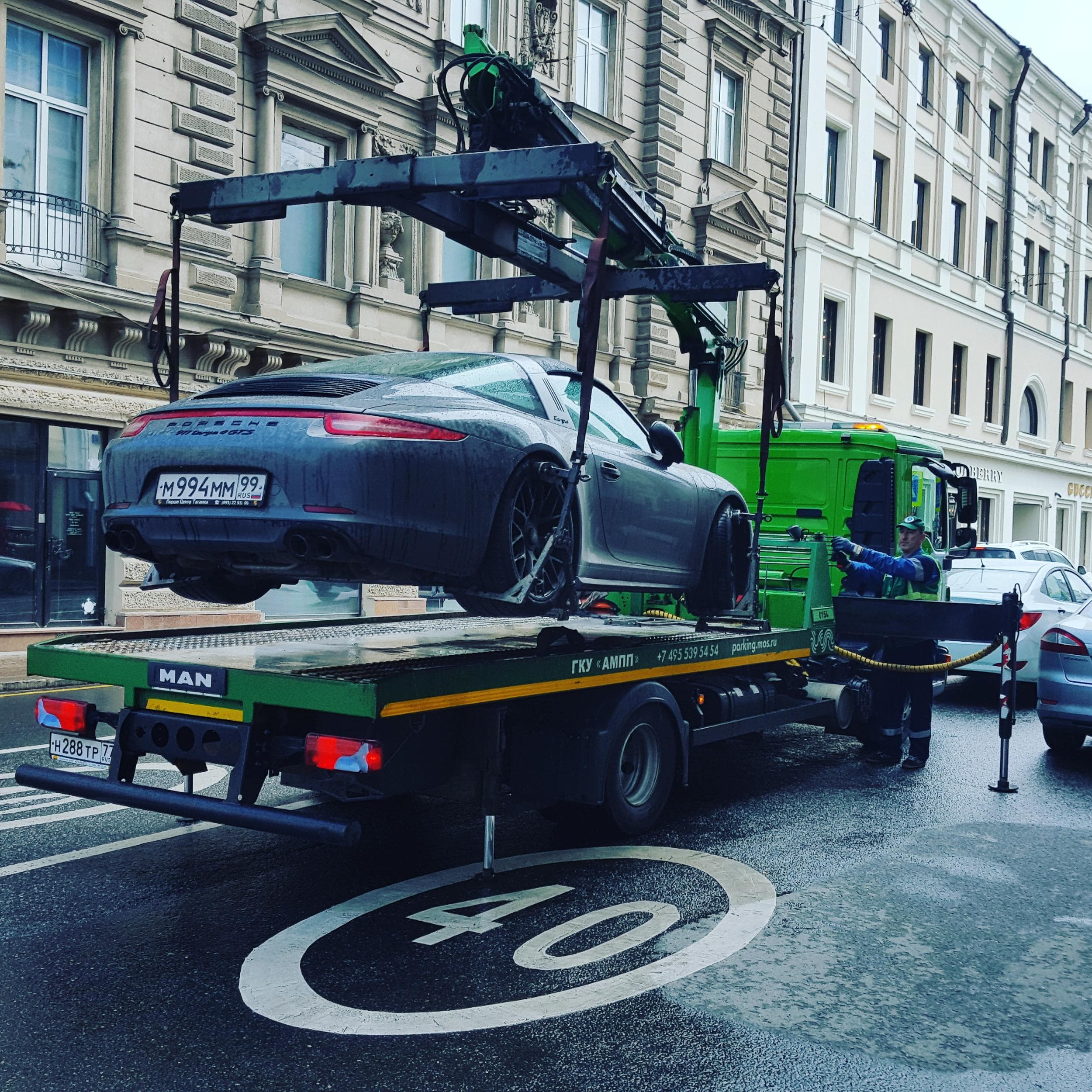 Tow truck lifting a car